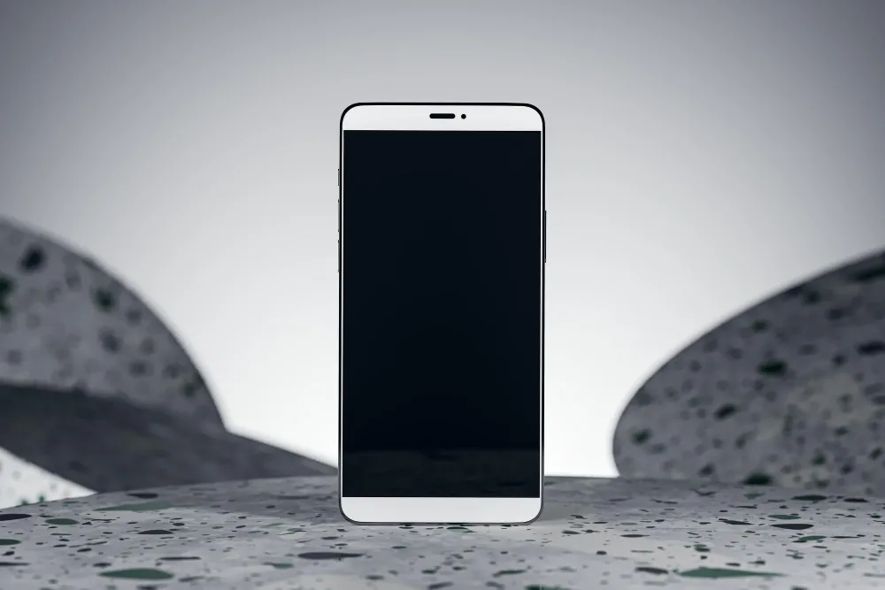 Smartphone standing upright with a black, blank screen