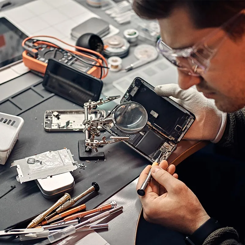 URPhone Store technician repairing a smartphone in Orlando