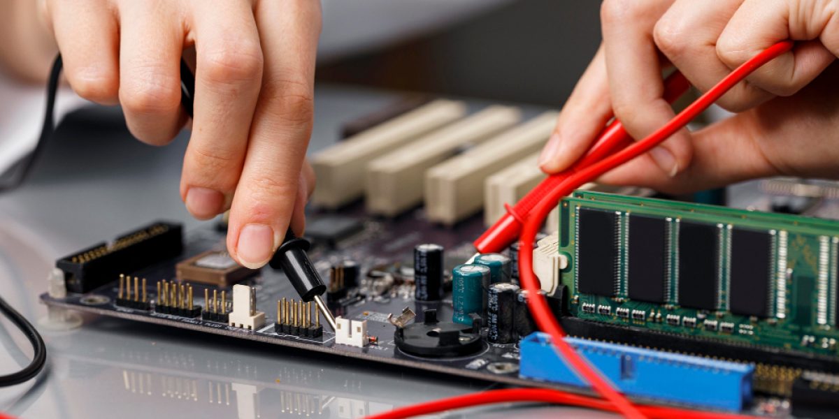 female-technician-repairing-computer-motherboard